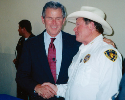 Butch Cappell and George Bush Jr shaking hands